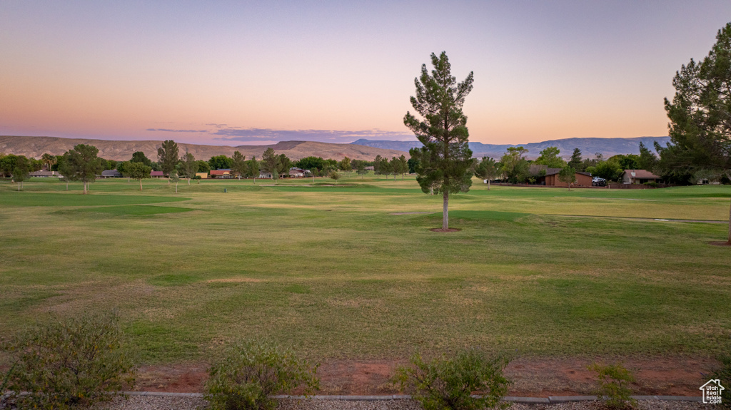 View of community with a lawn and a mountain view