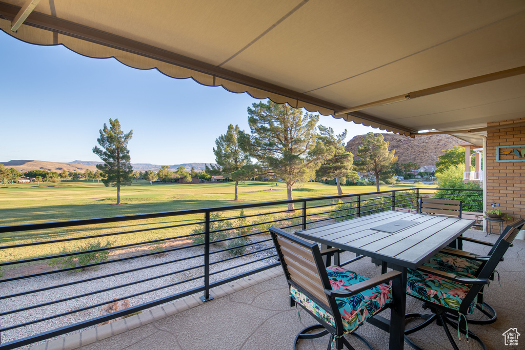 Exterior space featuring a balcony and a mountain view