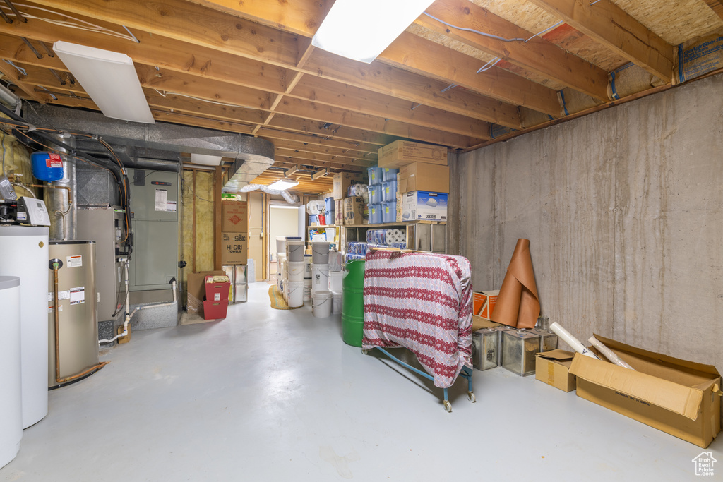 Basement featuring water heater