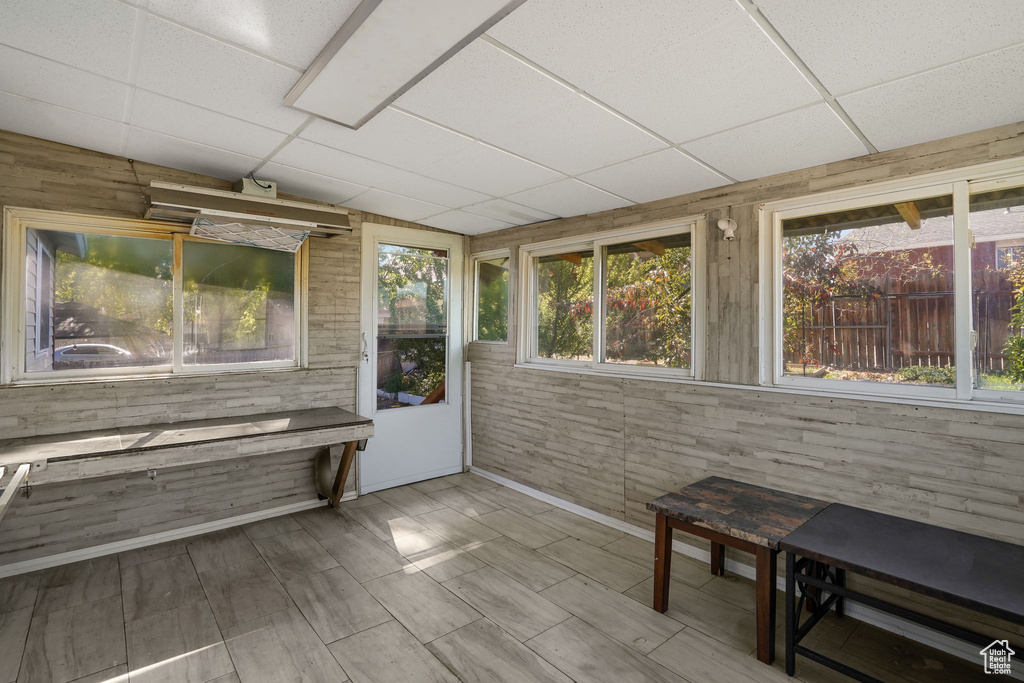 Sunroom / solarium with a paneled ceiling