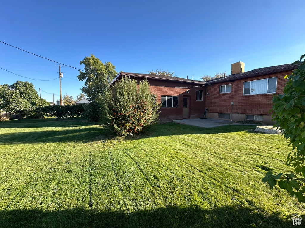 View of yard with a patio