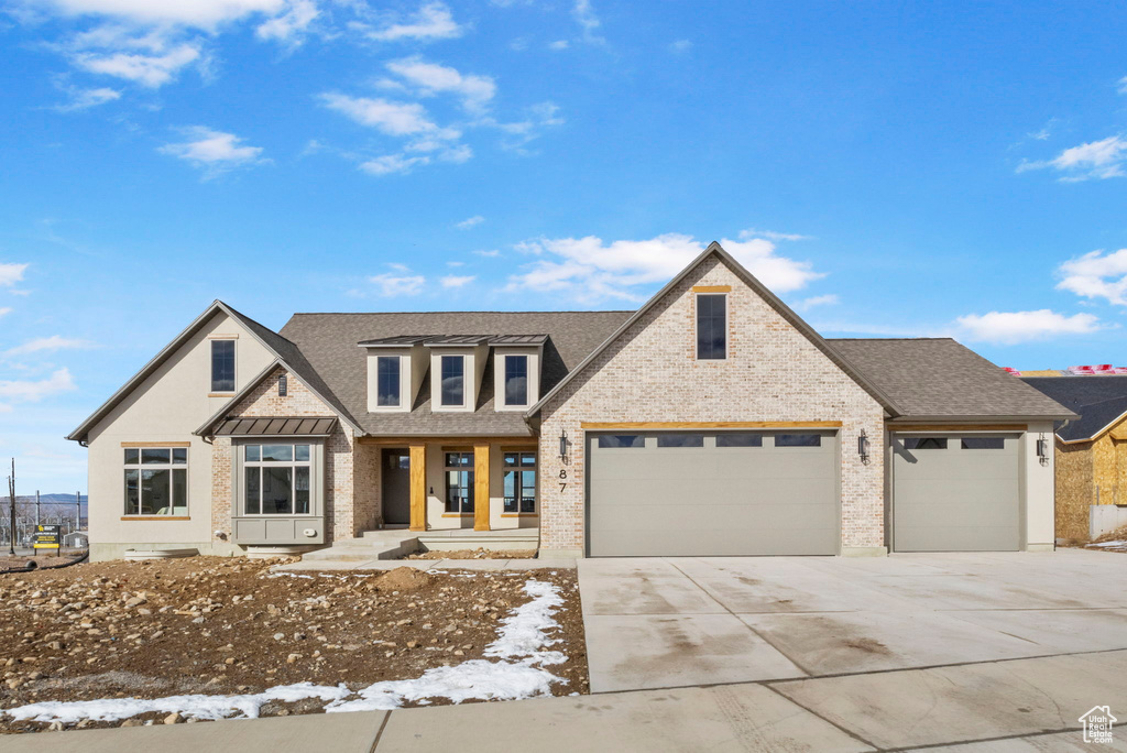 View of front of home featuring a garage