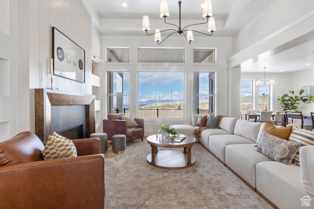 Living room with a chandelier and carpet