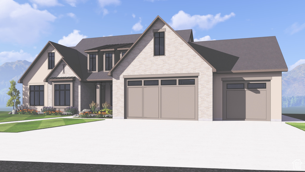 View of front facade with a garage, a front lawn, and a mountain view