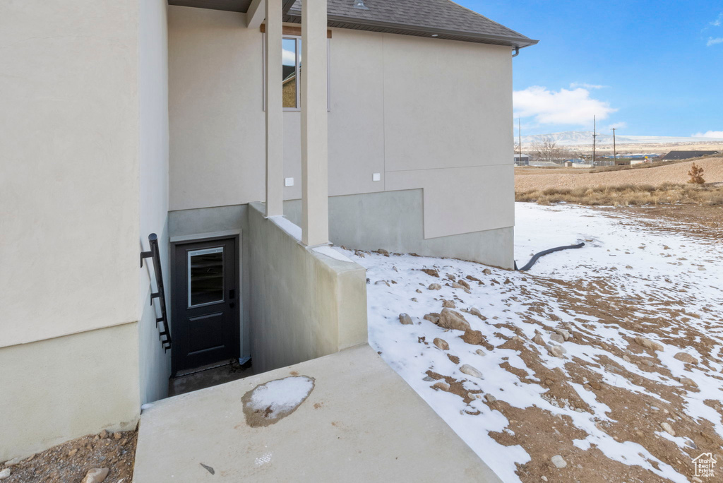 View of snow covered property entrance