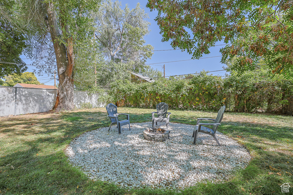 View of yard featuring a fire pit