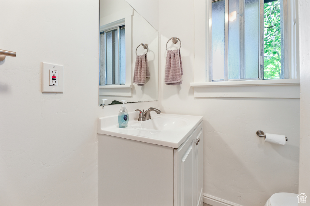 Bathroom with vanity and toilet