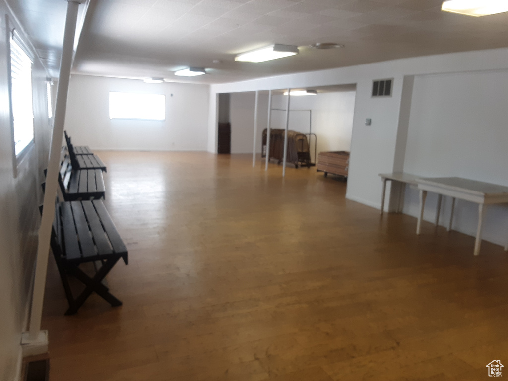 Basement featuring wood-type flooring