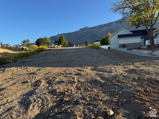 Exterior space with a mountain view and a garage