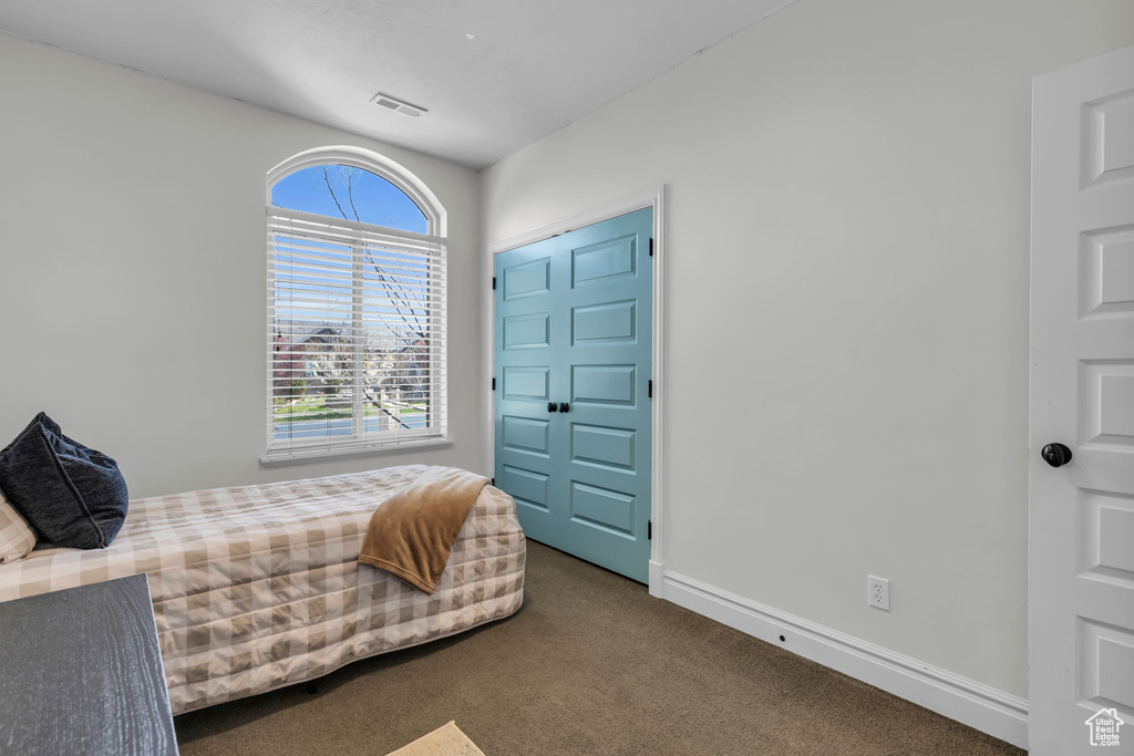 Bedroom featuring carpet floors and a closet