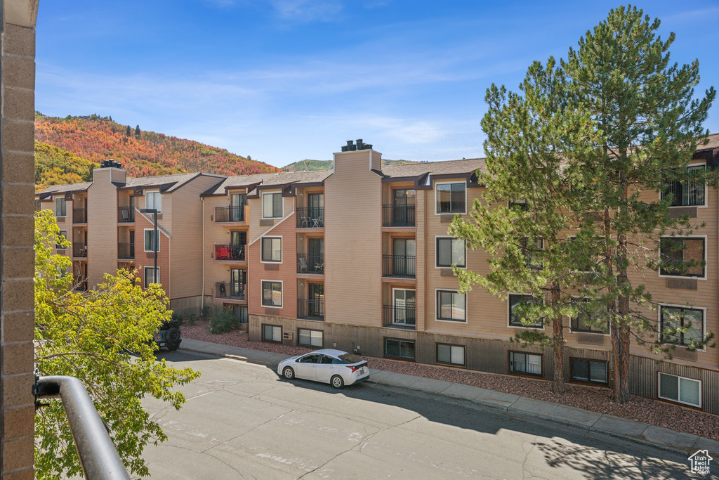 View of building exterior featuring a mountain view