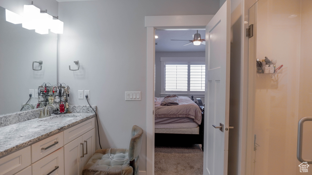 Bathroom featuring vanity and ceiling fan