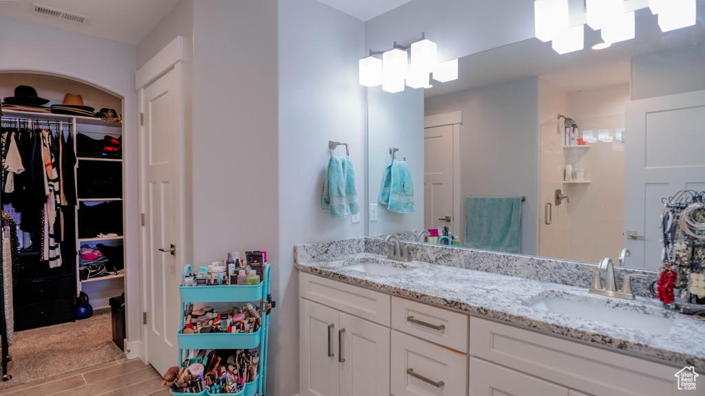 Bathroom featuring vanity and hardwood / wood-style flooring