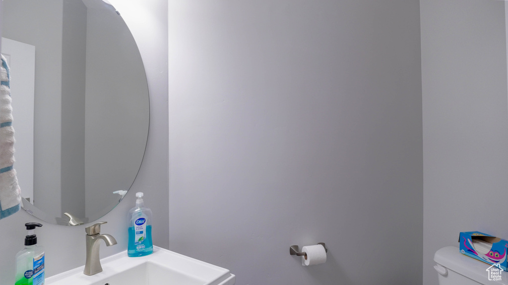 Bathroom featuring sink and toilet