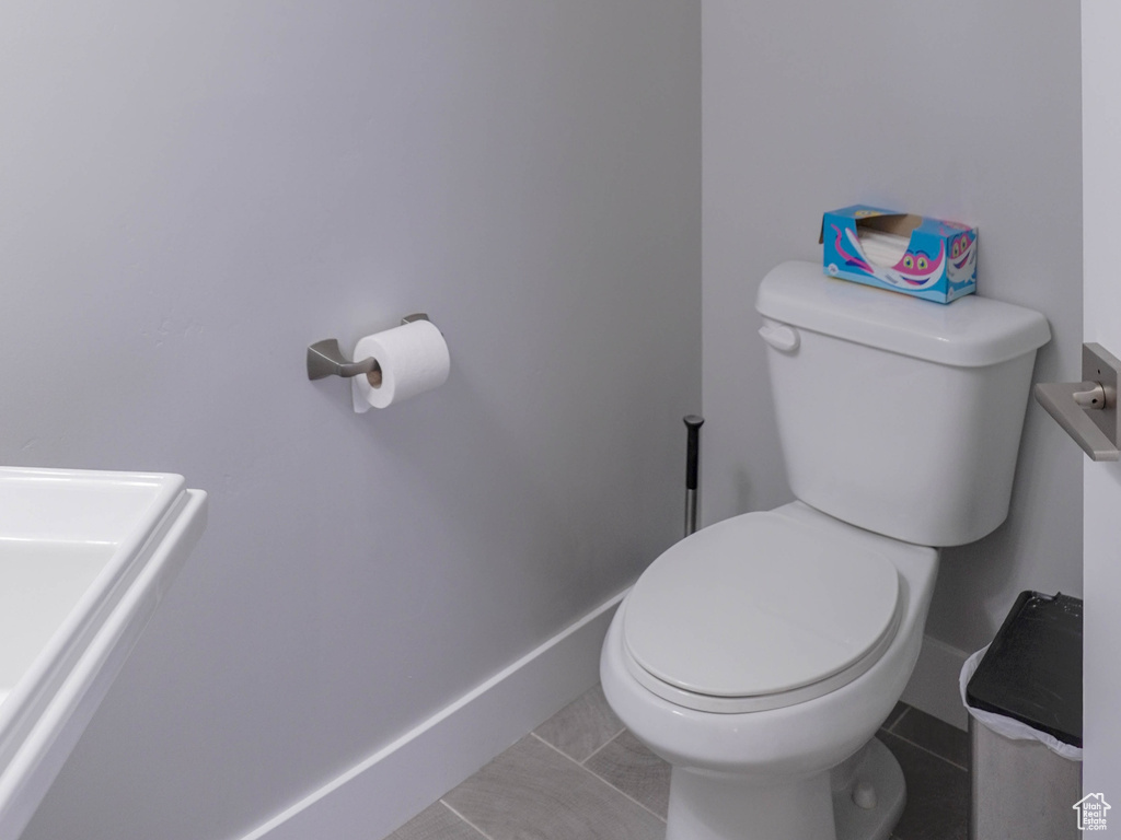 Bathroom featuring tile patterned flooring and toilet