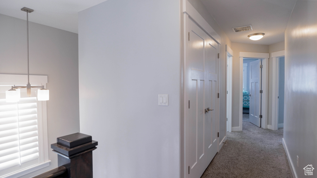 Hallway with carpet floors