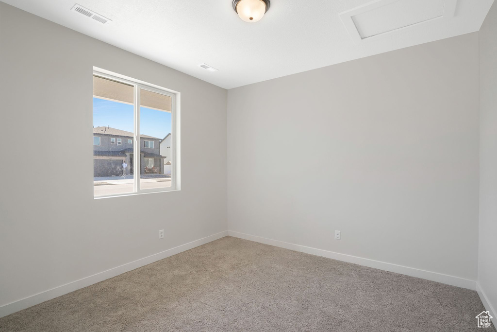 Empty room featuring carpet floors