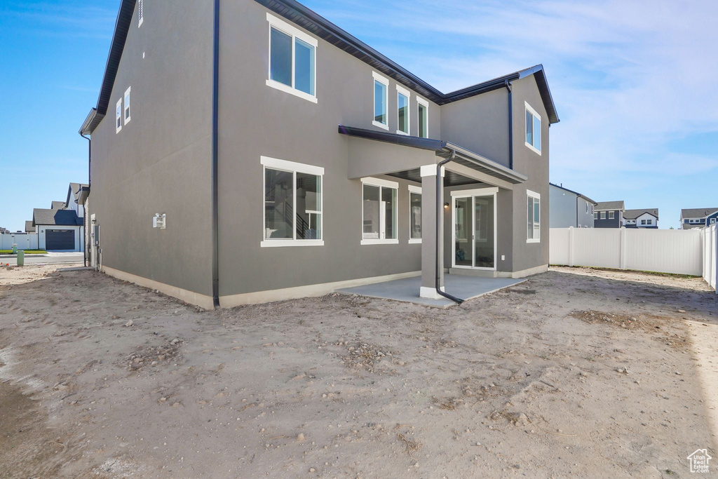 Rear view of property with a patio area