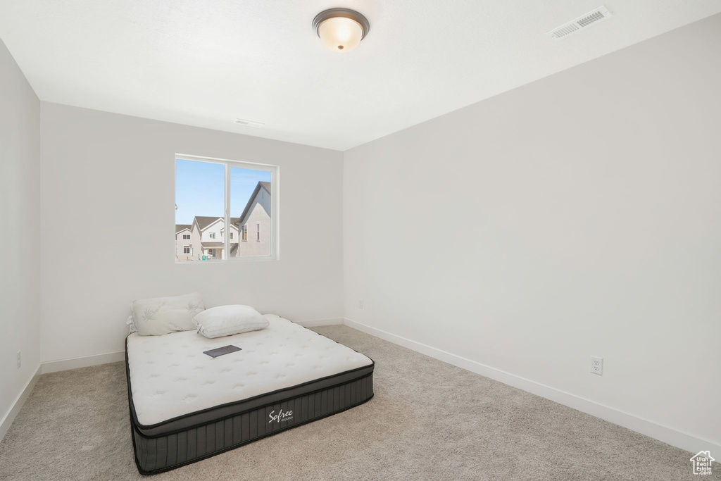 Bedroom featuring carpet