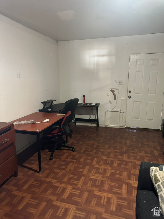 Home office featuring dark parquet floors