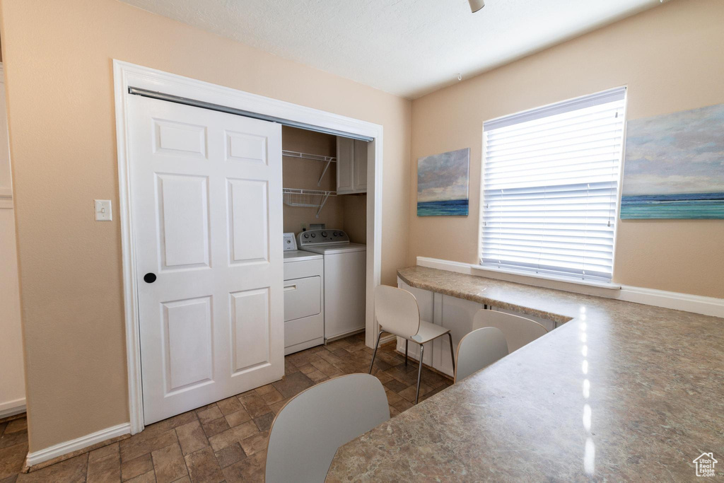 Interior space featuring washing machine and dryer