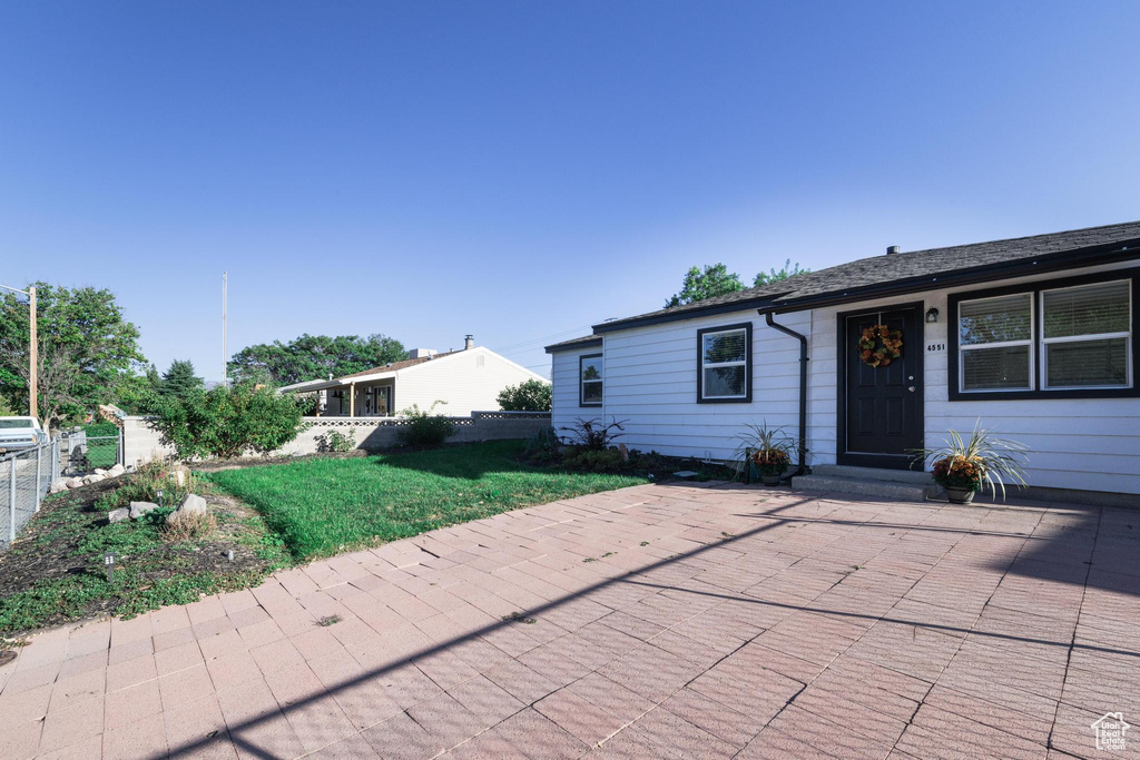 Exterior space featuring a front yard