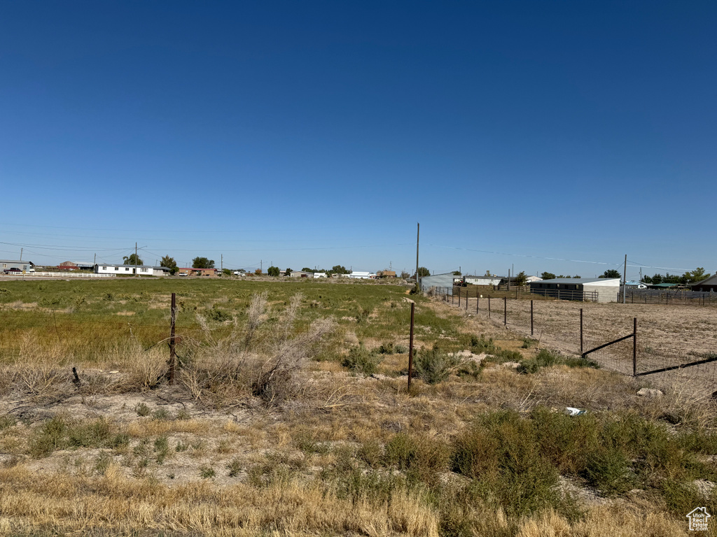 View of yard with a rural view