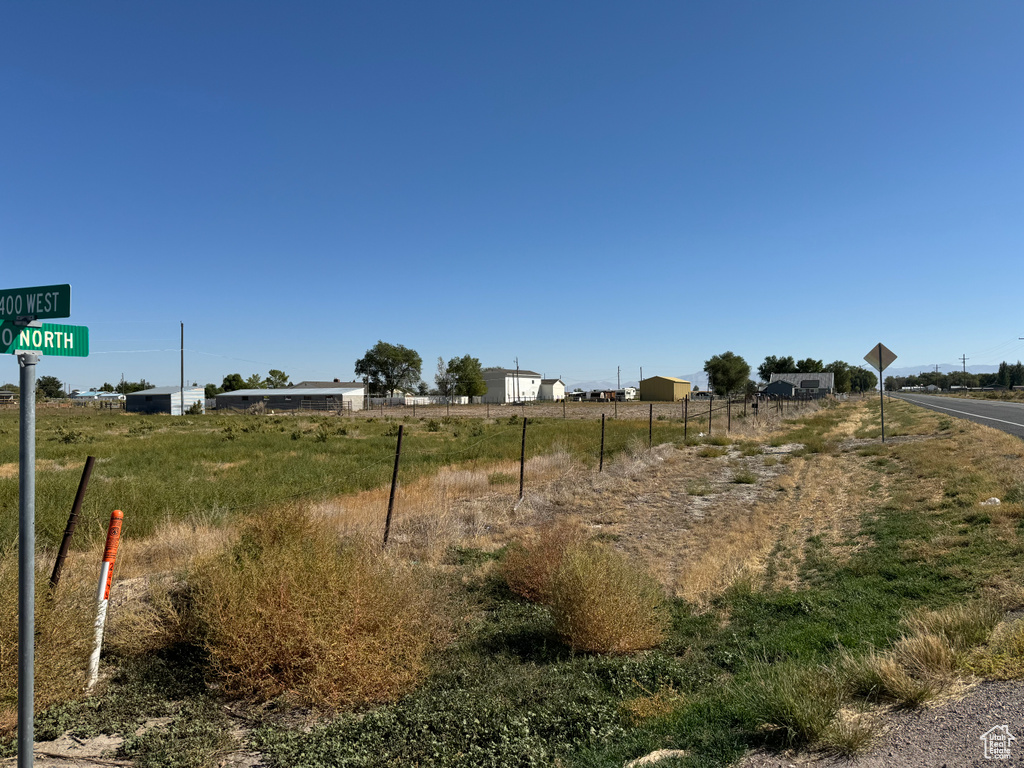 View of yard with a rural view