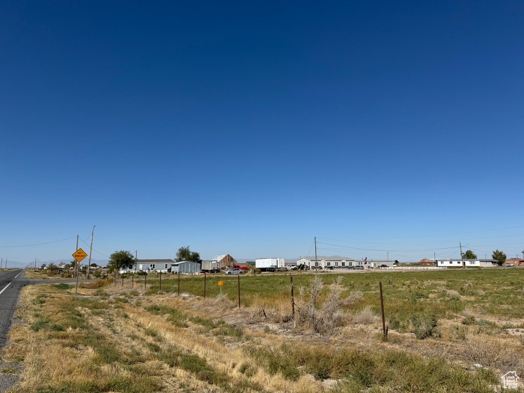 View of yard with a rural view