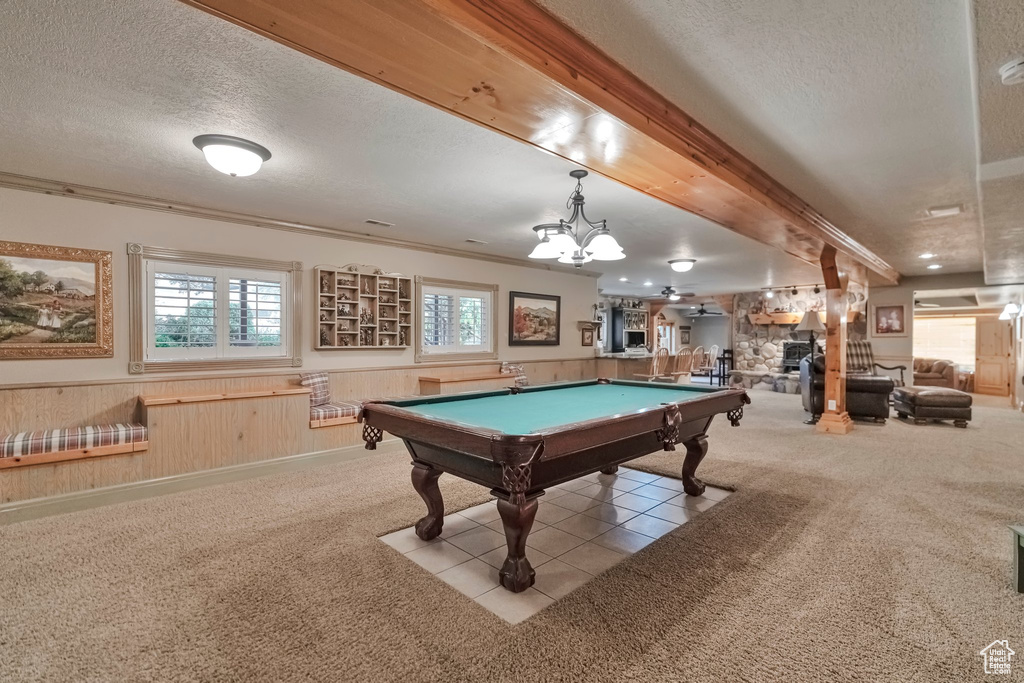 Recreation room with light carpet, beam ceiling, a textured ceiling, and billiards