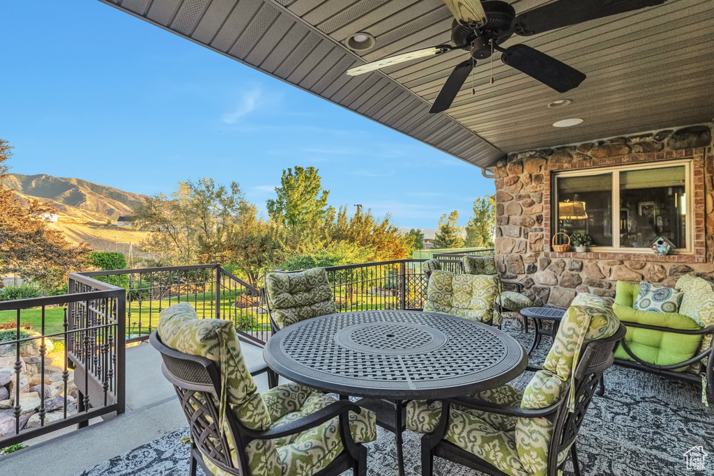 Balcony with ceiling fan and a mountain view