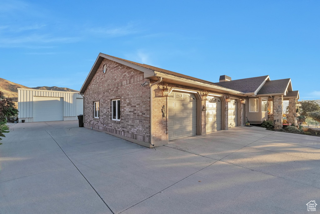 View of side of property featuring a garage