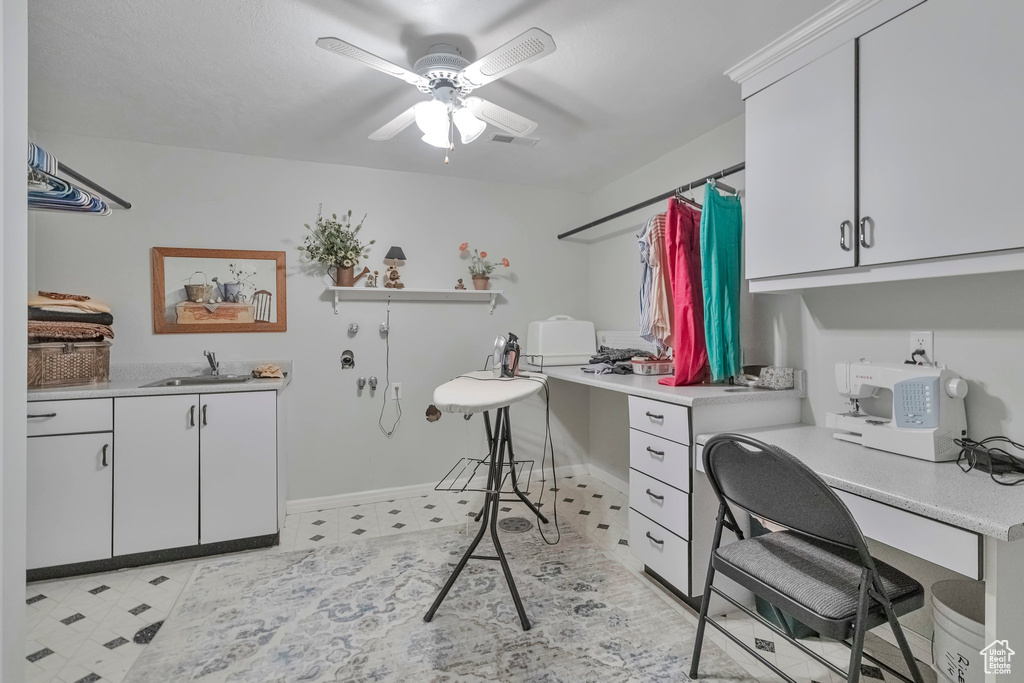 Office space featuring sink and ceiling fan