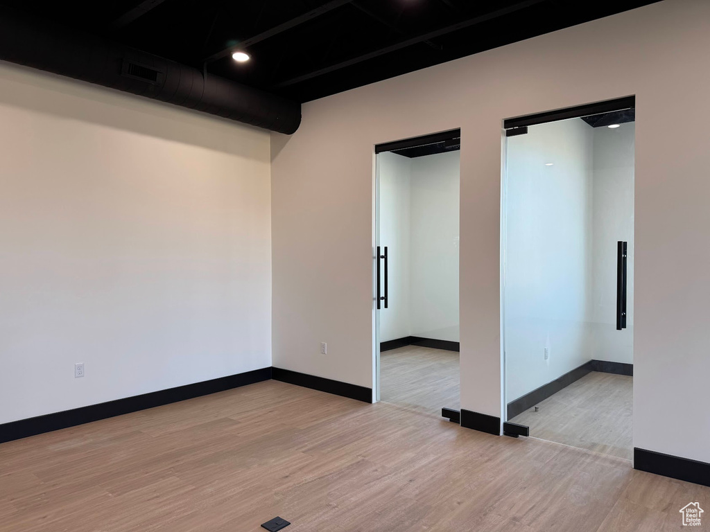 Spare room with light hardwood / wood-style flooring