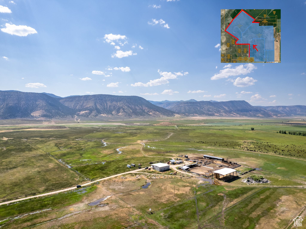 Property view of mountains with a rural view