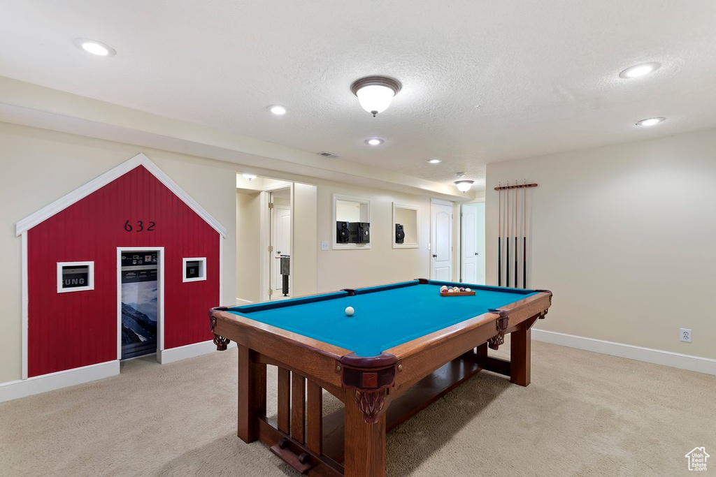 Rec room featuring light carpet, a textured ceiling, and pool table