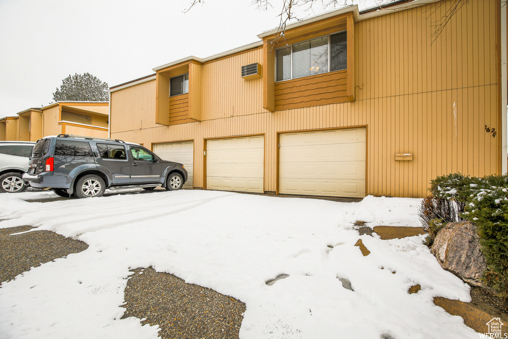 View of property featuring a garage