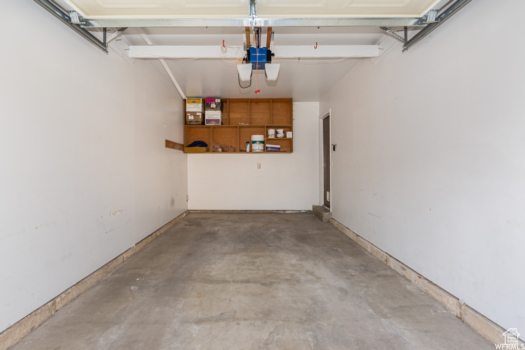 Garage featuring a garage door opener