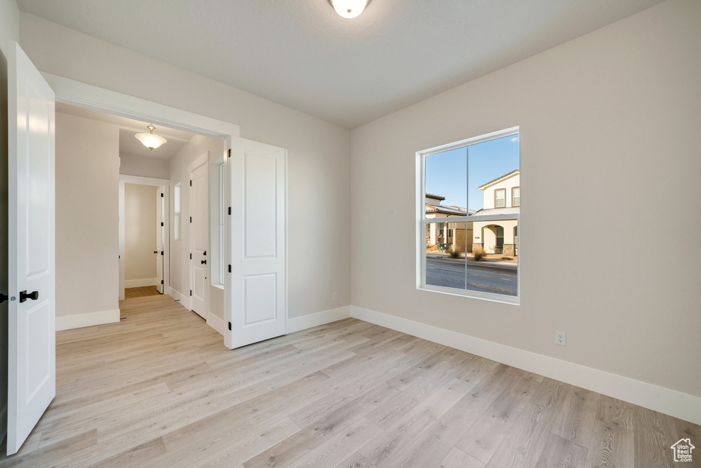 Spare room featuring light wood-type flooring