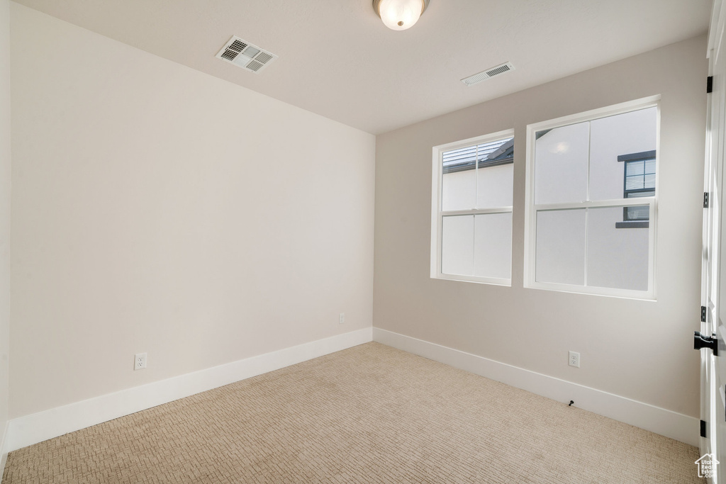 View of carpeted spare room