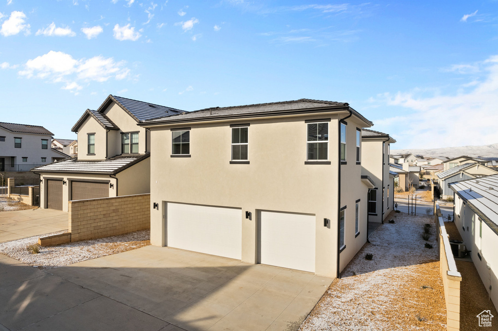 View of front of property featuring a garage