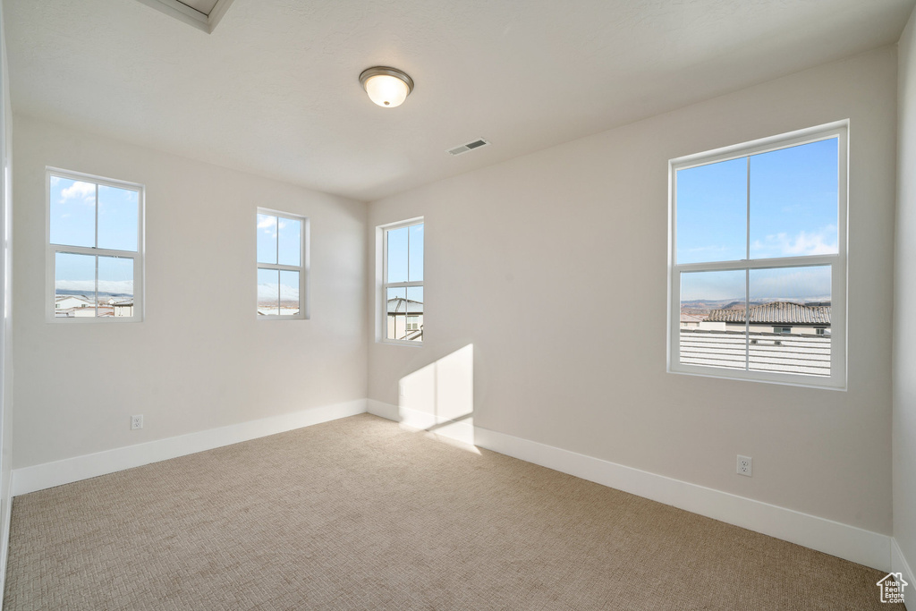 View of carpeted spare room