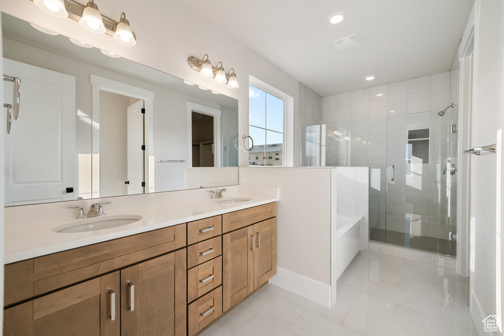 Bathroom with vanity and plus walk in shower