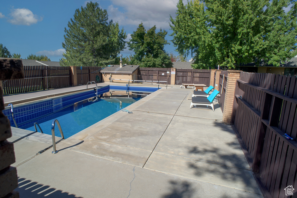 View of swimming pool with a patio