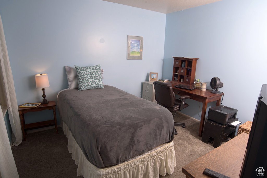 Bedroom featuring light colored carpet