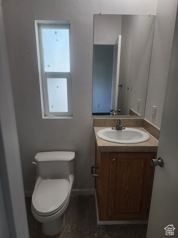 Bathroom featuring toilet and vanity