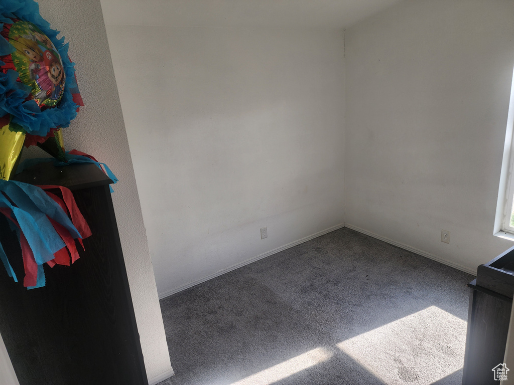 Spare room with carpet floors and baseboards