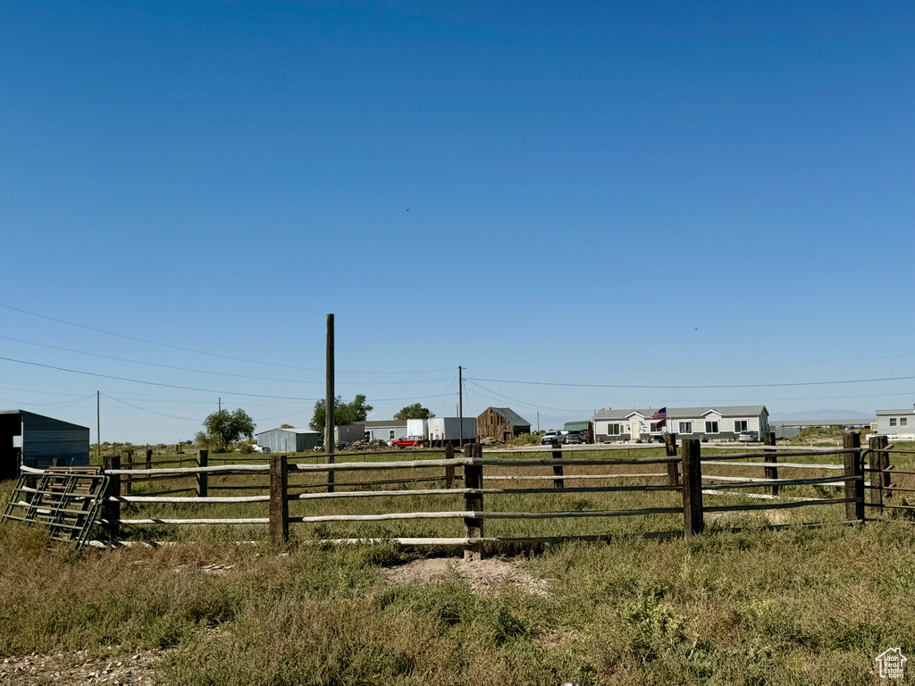 View of yard with a rural view