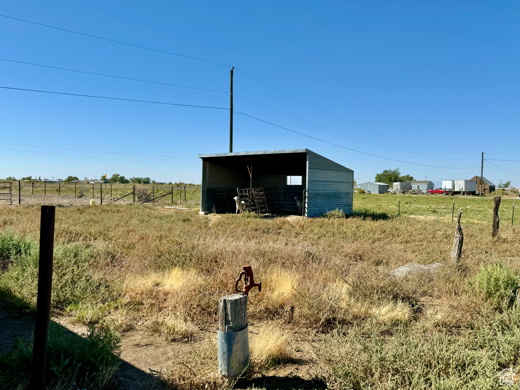 View of outbuilding featuring a rural view