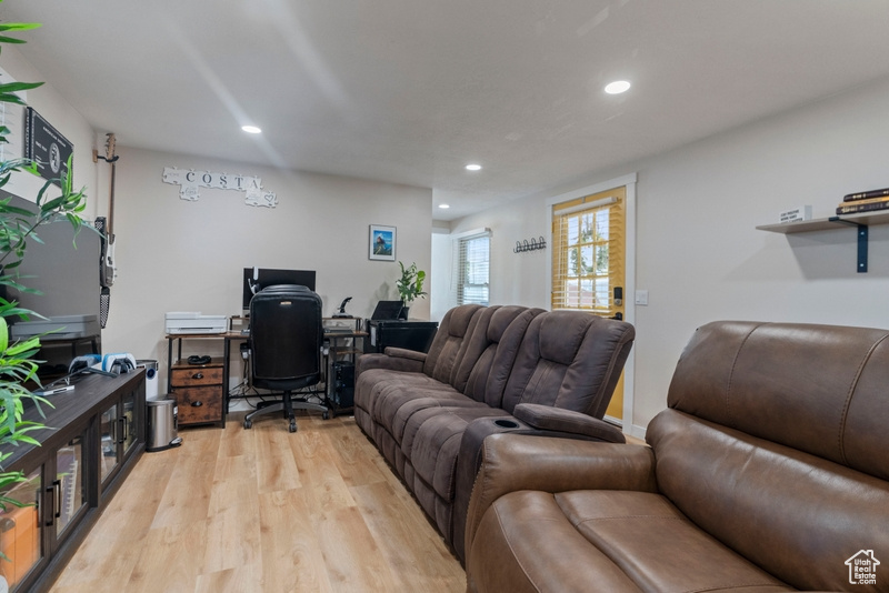 Living room with light hardwood / wood-style floors